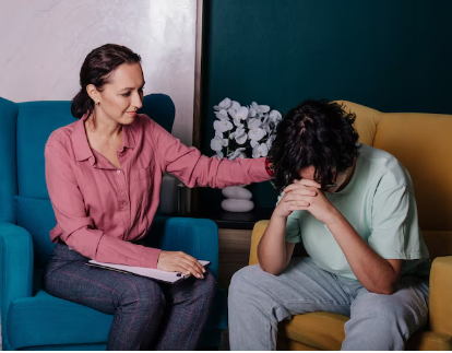 a lady supporting an unhappy man