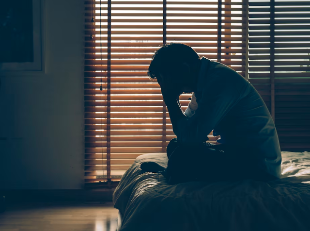 A person sitting with anxiety or depression