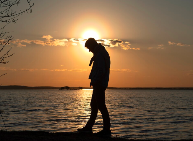 A person walking with grief