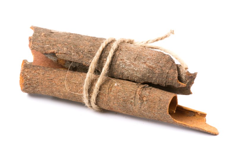 Cinnamon sticks on white background