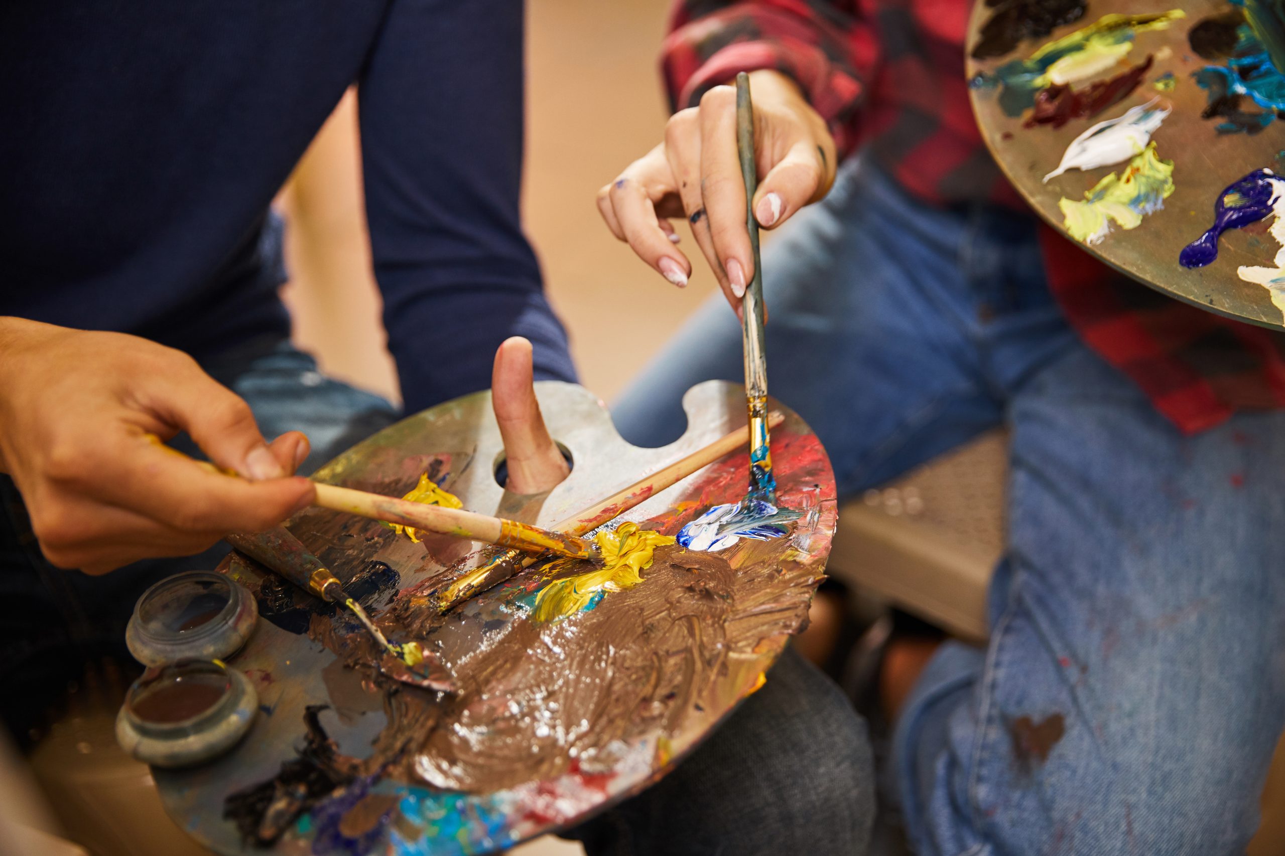 Indian child and caregiver engaging in creative activity